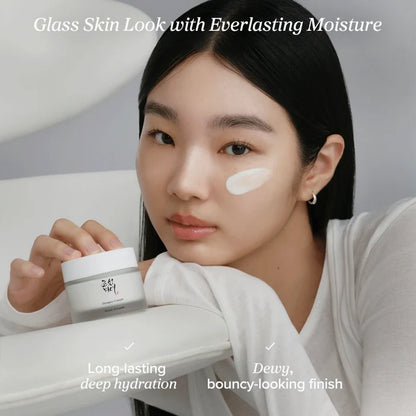 Woman holding a jar of cream with text about skincare benefits on a neutral background