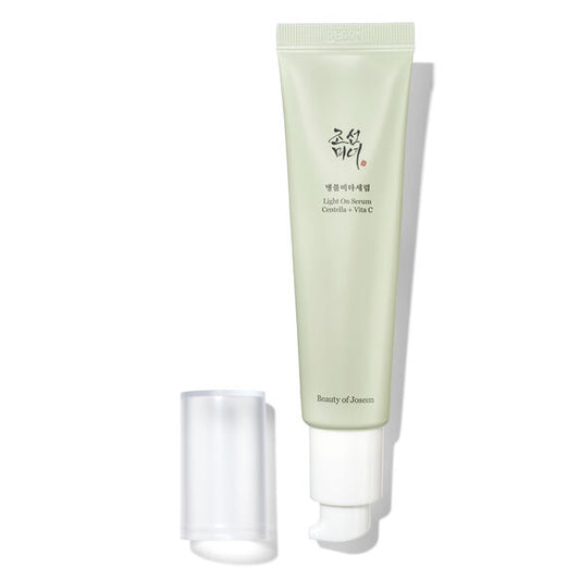 A light green squeeze tube of Beauty of Jerusalem Light Oil Serum with Korean text on the front, shown next to its clear cap on a white background with a soft shadow.