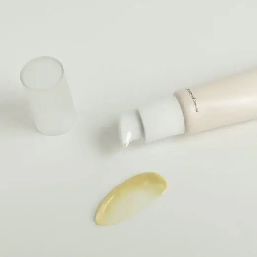 Beauty Of Joseon Revive Eye Serum 30ml with a droplet on a white surface, showcasing anti-aging properties.
