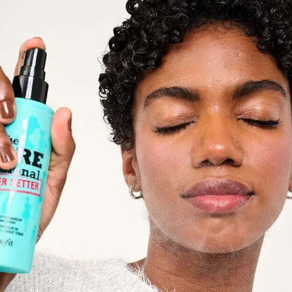 Model using Benefit The POREfessional Super Setter Setting Spray for a smooth, refreshed makeup finish.