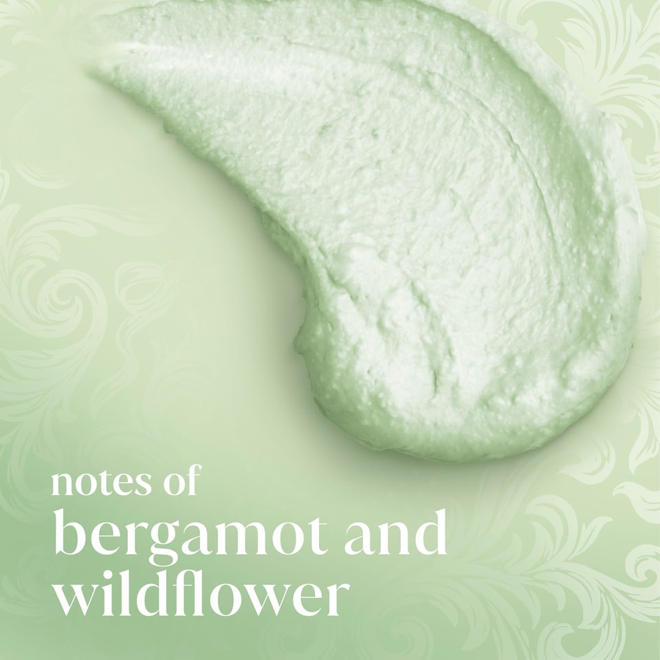 Dove Green cream with decorative swirls and text 'notes of bergamot and wildflower' on a green background