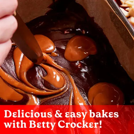 Swirling chocolate brownie batter with caramel swirls, showcasing delicious and easy baking from Betty Crocker.
