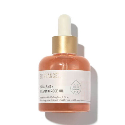 Biossance Squalane + Vitamin C Rose Oil in a glass bottle, designed to brighten and firm skin with hydration.