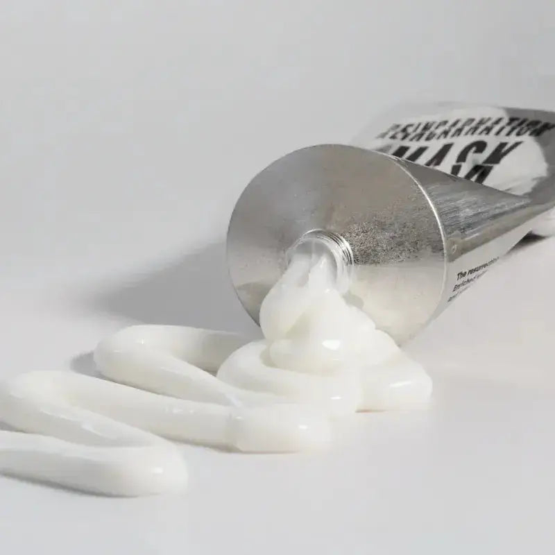 Bleach London Reincarnation Mask 50ml tube spilling creamy hair treatment on white background