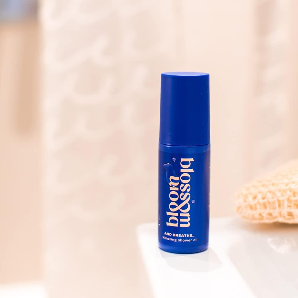 Blue bottle of  Bloom & Blossom 'bloom' product on a blurred background