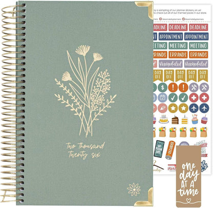 Bloom Daily Planners HARDCOVER 2026 with floral design, gold accents, and planner stickers for organized planning.