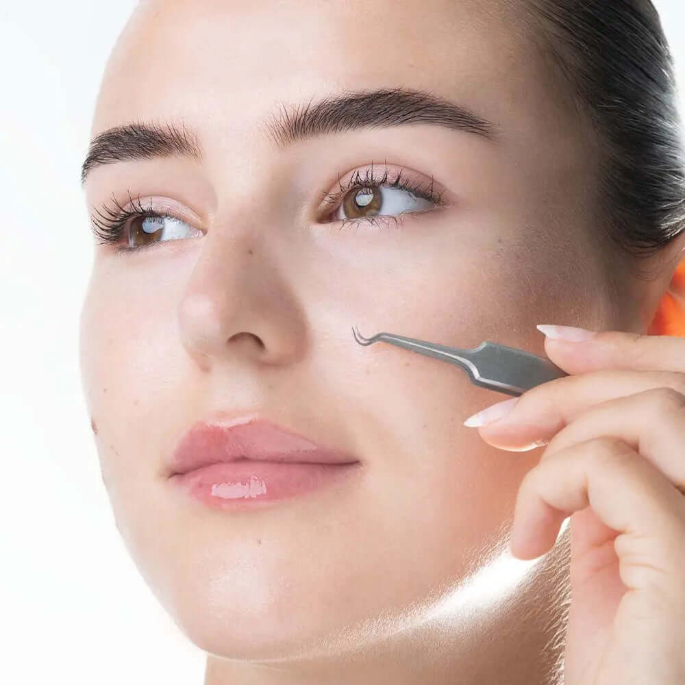 Woman using Brushworks Blackhead and Blemish Remover Set tool on her face for clear skin.