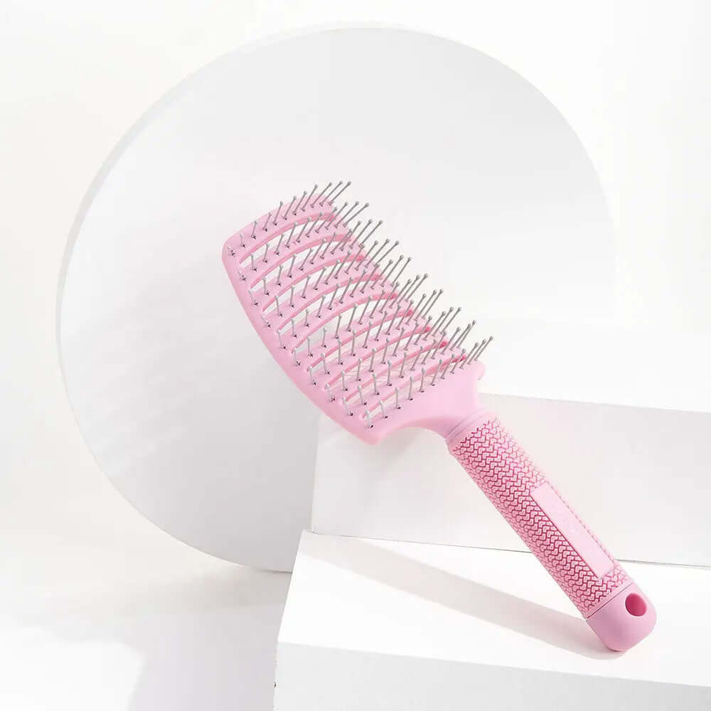 Brushworks Blow Dry Paddle Brush in pink, designed for salon-quality blow-dry and suitable for all hair types.