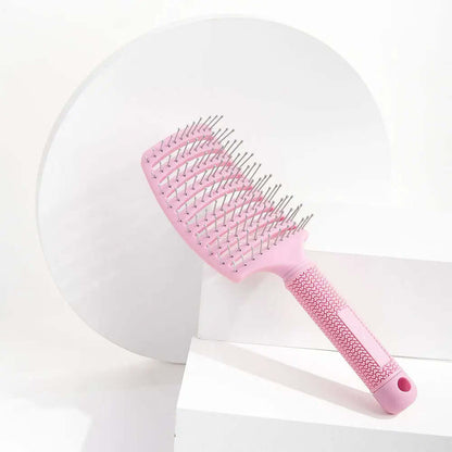 Brushworks Blow Dry Paddle Brush in pink, designed for salon-quality blow-dry and suitable for all hair types.