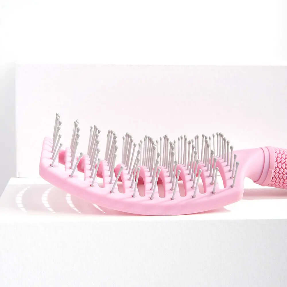Brushworks Blow Dry Paddle Brush in pink, ideal for all hair types, with soft bristles and easy-grip handle.