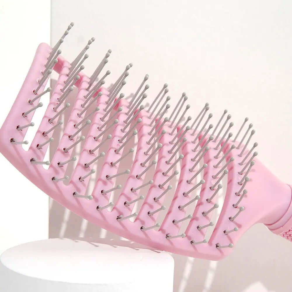 Brushworks Blow Dry Paddle Brush in pink, designed for gentle detangling and efficient blow-drying for all hair types.