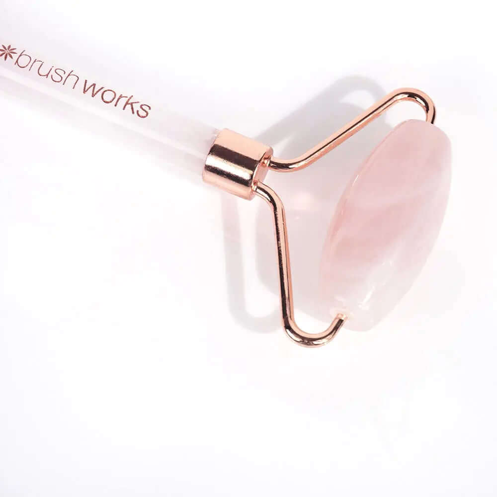 Brushworks Brazilian Rose Quartz Stone Roller with dual-ended design for facial massage and skincare absorption.