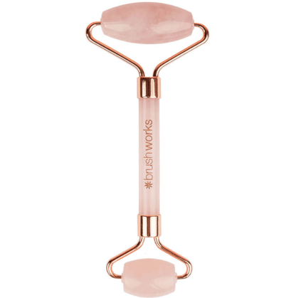 Brushworks Brazilian Rose Quartz Stone Roller for facial massage, promoting blood flow and enhancing skincare absorption.