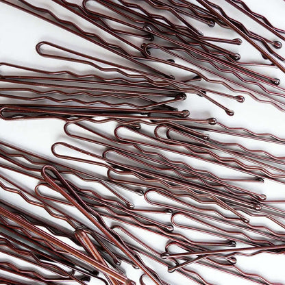 Brushworks Brown Bobby Pins ideal for brunette hair, providing a secure hold and keeping stray hairs in place.