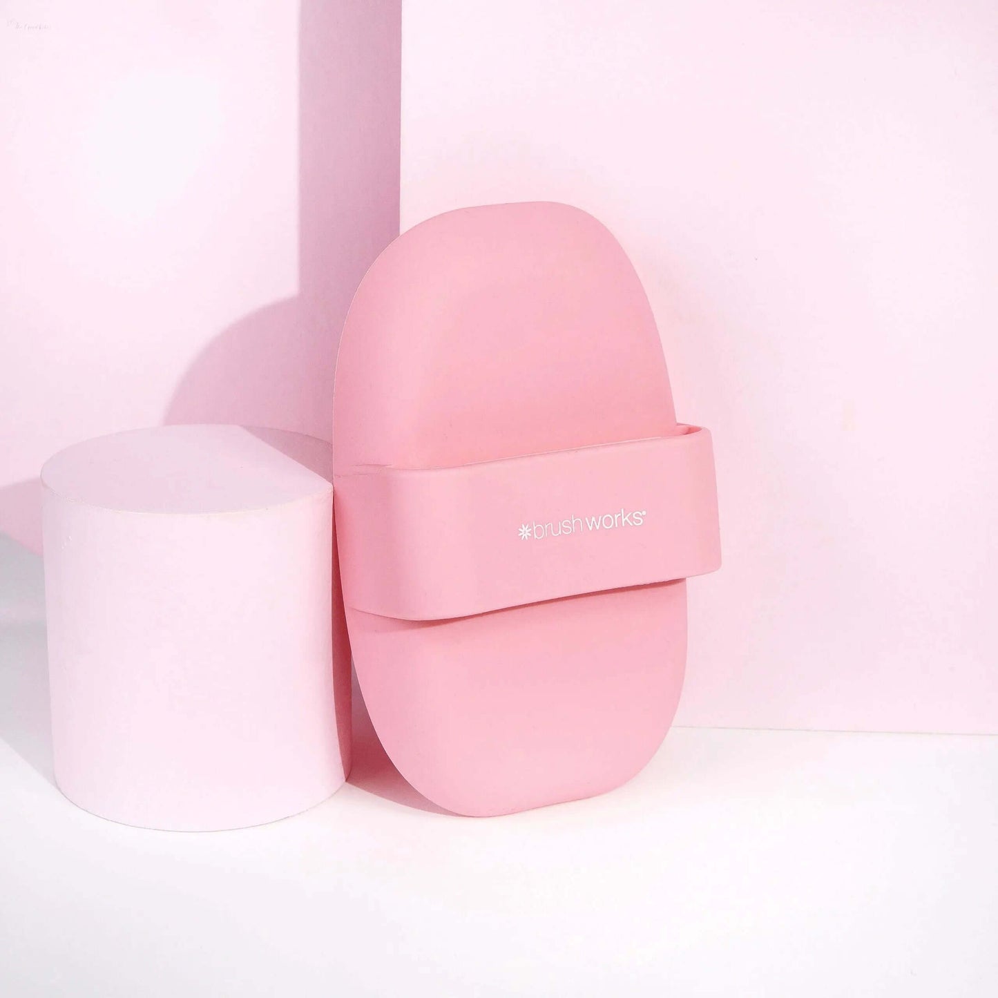 Brushworks Brush Cleaner Palette in pink with ergonomic design for effective brush cleaning.