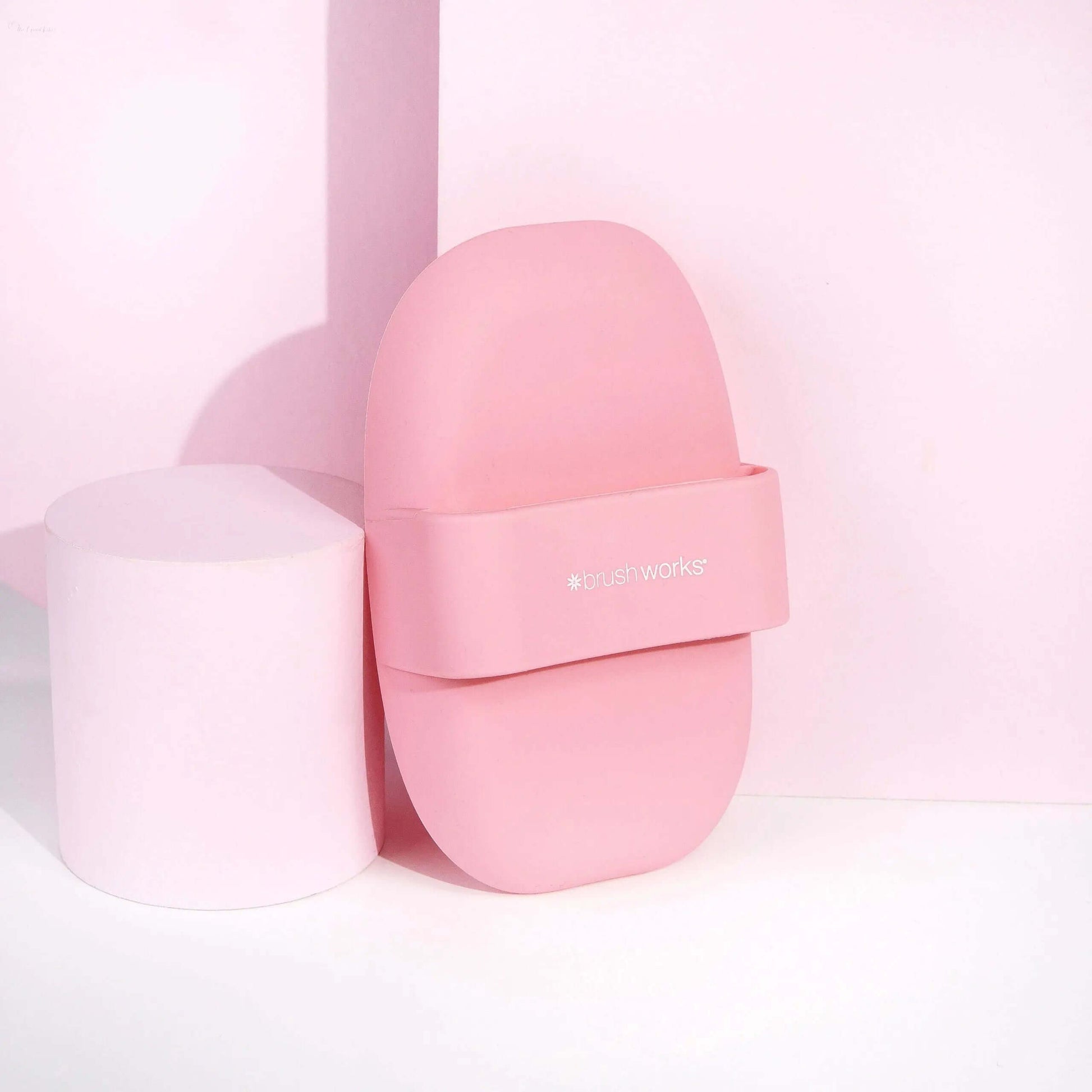 Brushworks Brush Cleaner Palette in pink with ergonomic design for effective brush cleaning.