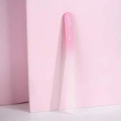 Brushworks Crystal Glass File on a pink background, ideal for shaping and tidying nails.