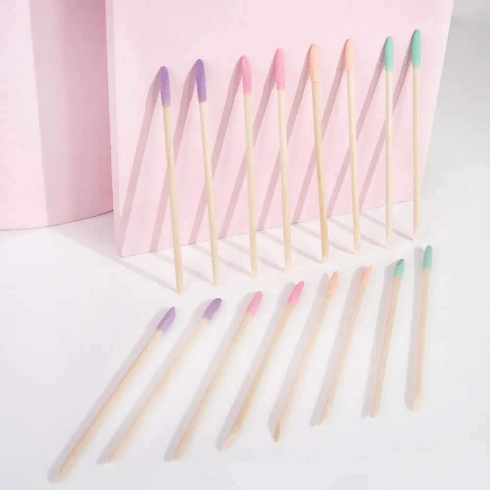 Brushworks Cuticle Crystal Sticks in pastel colors, arranged for manicuring cuticles, featuring dual-ended designs.