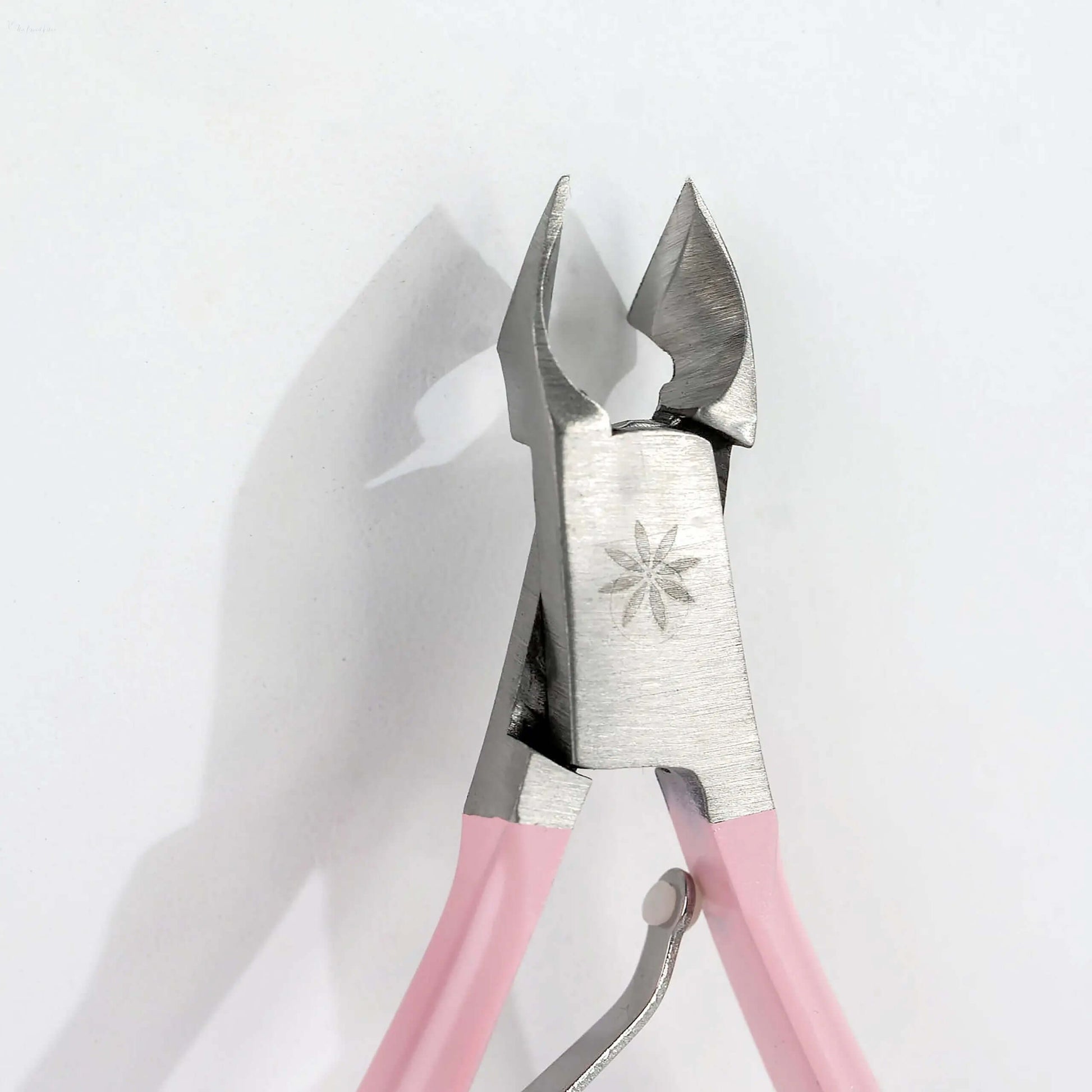 Brushworks Cuticle Nippers with pink handles, stainless steel, ideal for tidy and pain-free nail care.