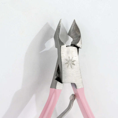 Brushworks Cuticle Nippers with pink handles, stainless steel, ideal for tidy and pain-free nail care.