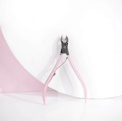 Brushworks Cuticle Nippers with pink handles on a white background, perfect for a clean and pain-free manicure.