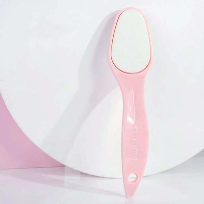 Brushworks Foot File in pink, designed to easily remove dry skin for soft, smooth feet with an ergonomic handle.
