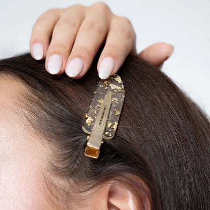Brushworks Gold Flake No Crease Clip stylishly holding back hair, designed to prevent kinks and suitable for all hair types.