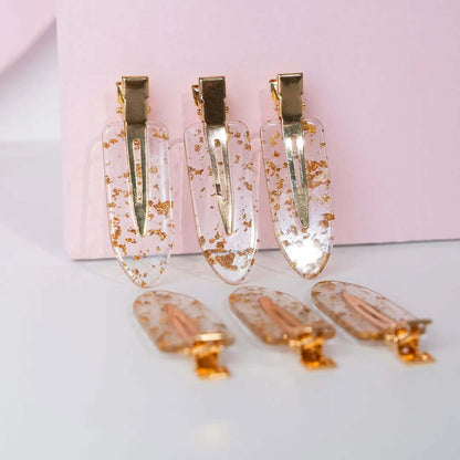 Brushworks Gold Flake No Crease Clips in clear and gold design, perfect for keeping hair stylishly in place without kinks.