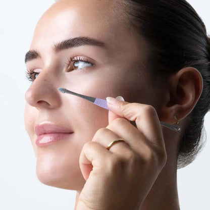 Woman using Brushworks HD Blackhead and Blemish Remover Set on her nose for skin care.