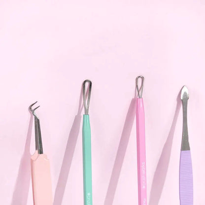 Brushworks HD Blackhead and Blemish Remover Set tools in pastel colors on a pink background, perfect for clear skin.