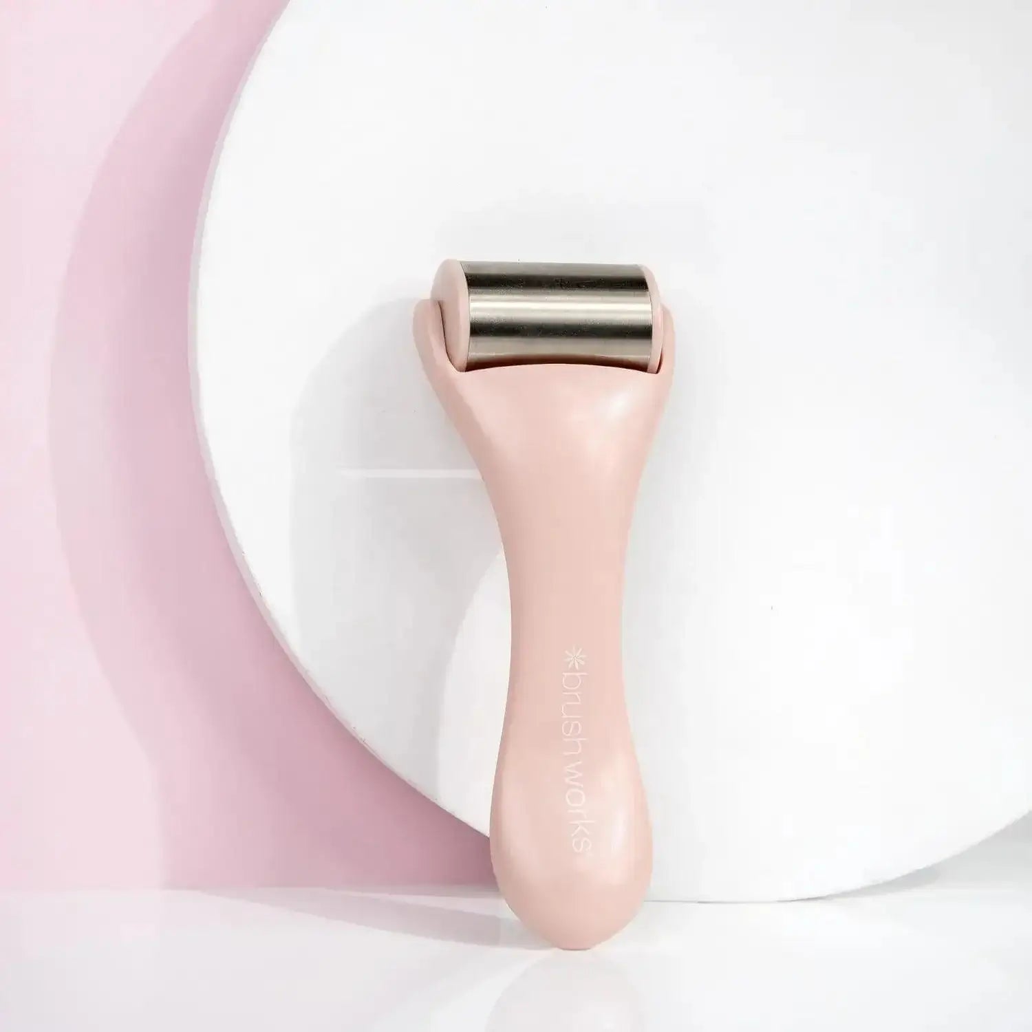 Brushworks Ice Roller on a white surface, designed to reduce puffiness and redness for a balanced complexion.