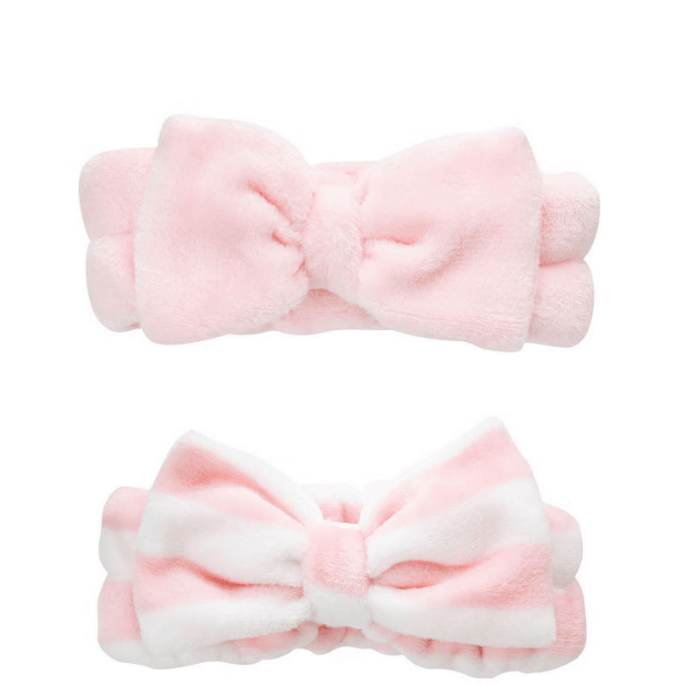 Brushworks Makeup Headbands 2 Pack in pink, featuring soft fabric and decorative bows for comfortable skincare and makeup application.