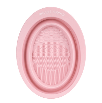 Brushworks Silicone Makeup Brush Cleaning Bowl with textured surface for deep cleaning, lightweight and foldable design.