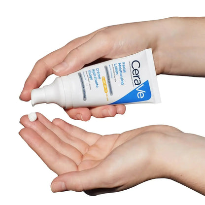 CeraVe AM Facial Moisturising Lotion SPF30 for normal to dry skin, being dispensed onto a hand.