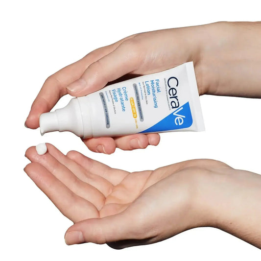 CeraVe AM Facial Moisturising Lotion SPF30 for normal to dry skin, being dispensed onto a hand.