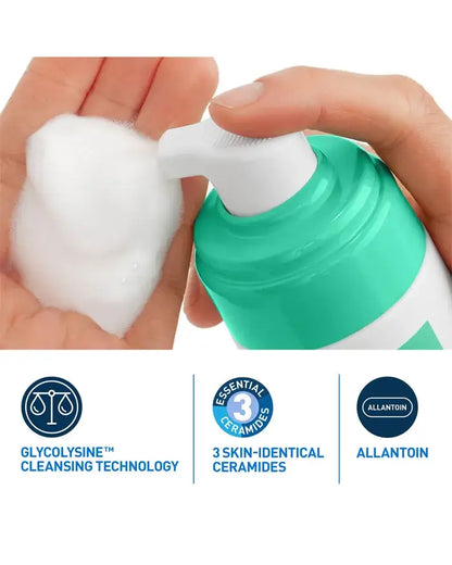 Hand holding a bottle of skincare product with text highlighting ingredients on a white background