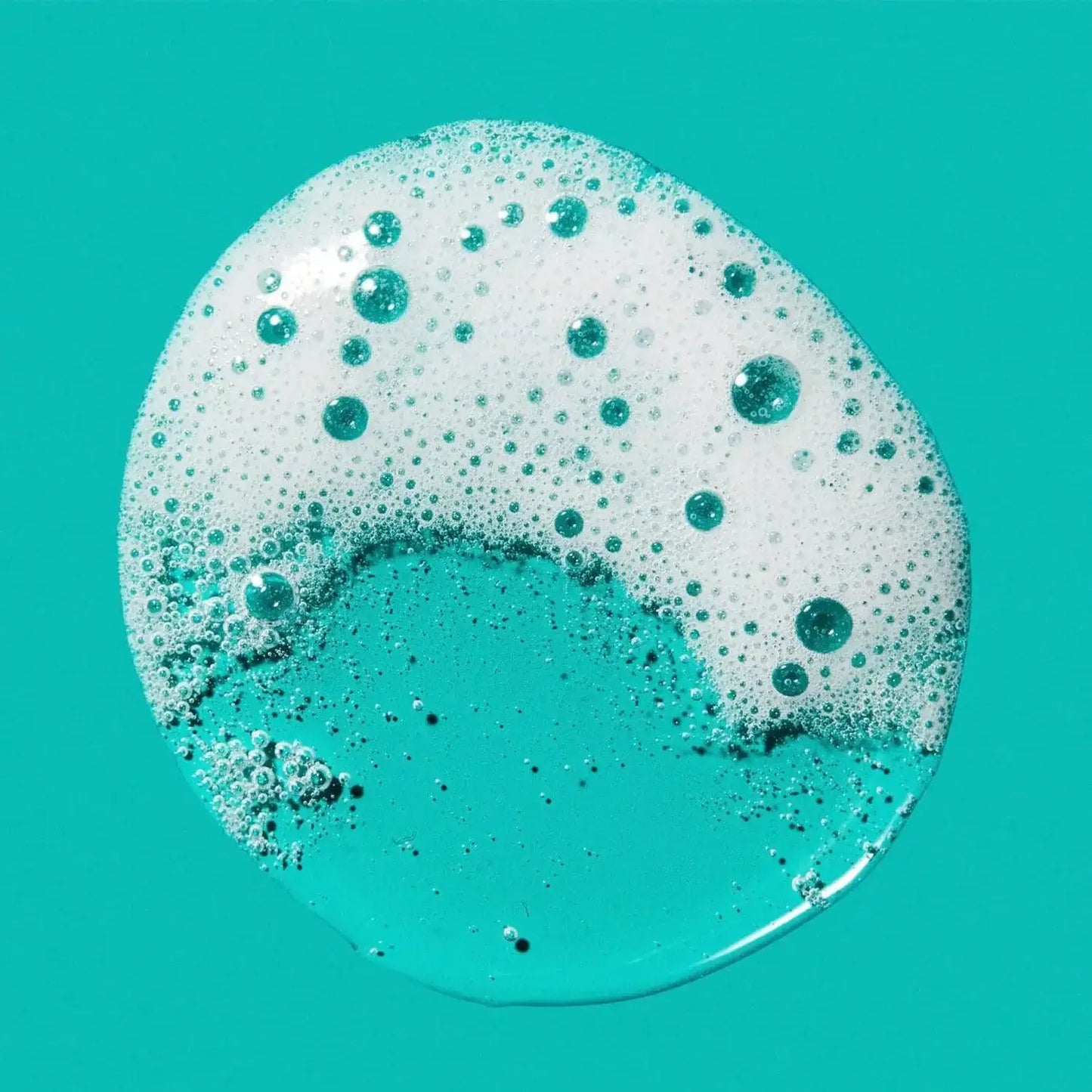 CeraVe Blemish Control Face Cleanser foam with bubbles on a turquoise background.