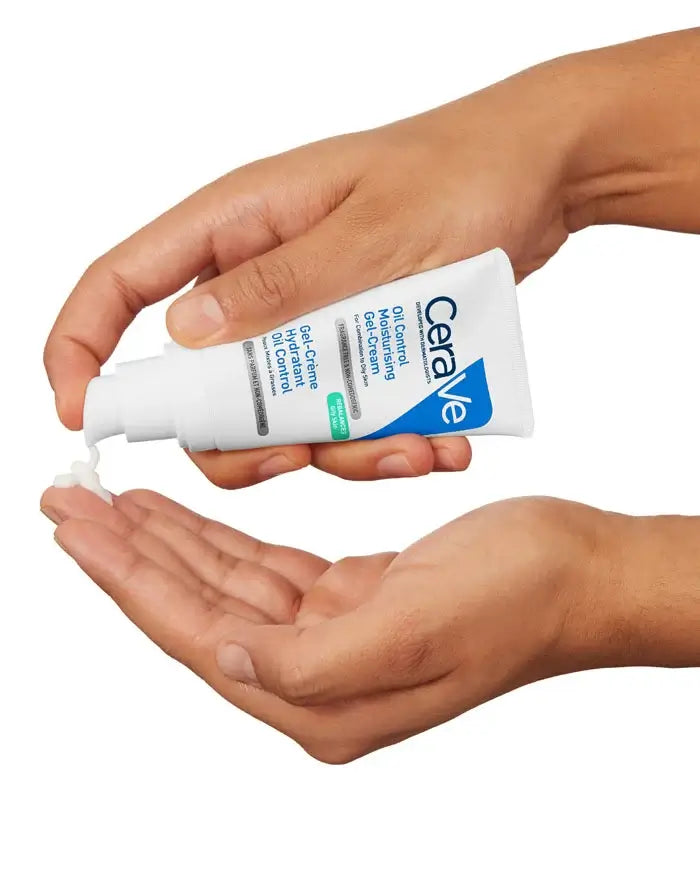 CeraVe moisturizing cream being applied to a hand on a white background