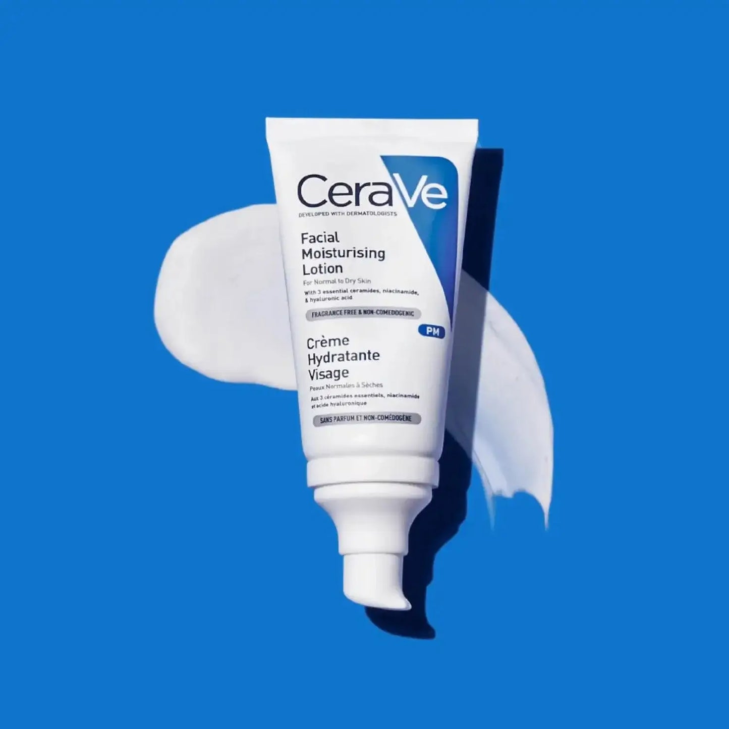 CeraVe PM Facial Moisturising Lotion tube on blue background, ideal for normal to dry skin, 52ml.