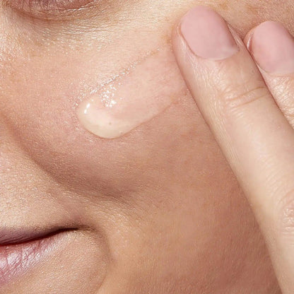 Applying CeraVe Resurfacing Retinol Serum with Ceramides to blemish-prone skin for an even complexion.