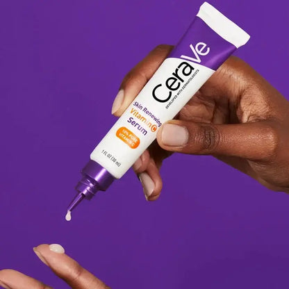 CeraVe serum tube being applied to a hand against a purple background