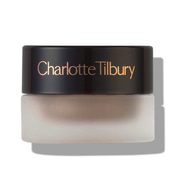 Charlotte Tilbury makeup product with black lid on a white background