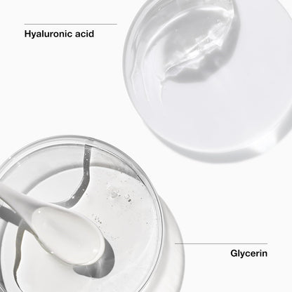 Close-up of CLINIQUE All About Clean™ Foaming Facial Soap lathering on skin, showing its creamy foaming texture.