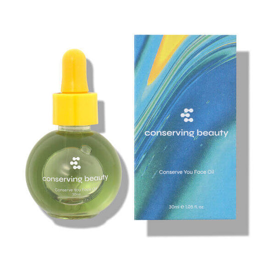 Conserving Beauty Conserve You Face Oil with bright yellow dropper and colorful box packaging for radiant skin.