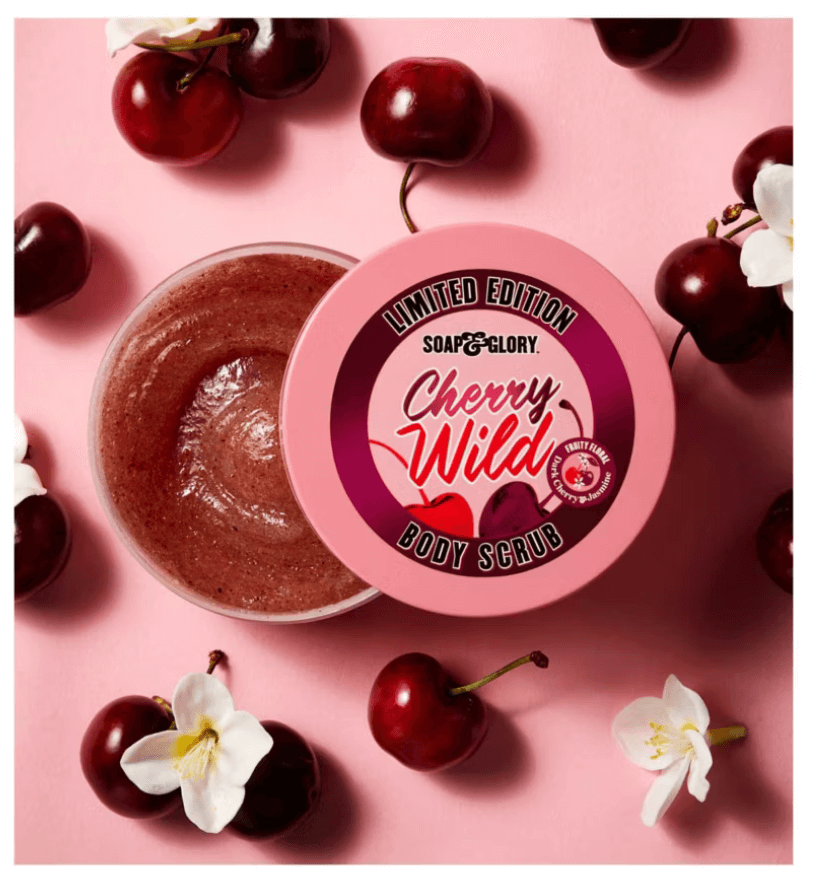 Soap & Glory Cherry Wild Body Scrub with dark cherries and jasmine blossoms, surrounded by cherries and flowers.