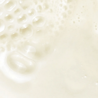 Close-up of creamy texture with bubbles, representing Kate Somerville Dermal Quench Liquid Lift + Retinol