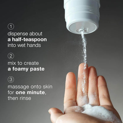 Hand using a white container to dispense a Dermalogica foamy paste onto wet hands with text instructions.