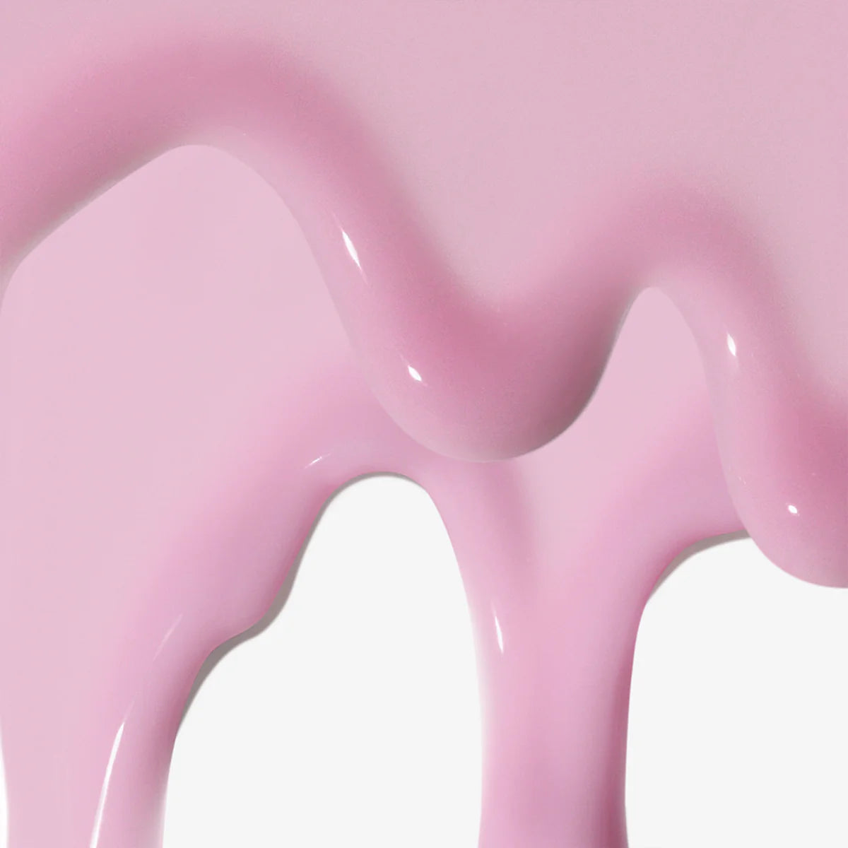 Close-up of a pink, glossy object with a smooth dermalogica texture.