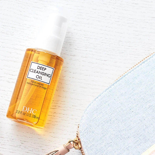 DHC Deep Cleansing Oil bottle on a white surface, excellent makeup remover and skin nourisher.