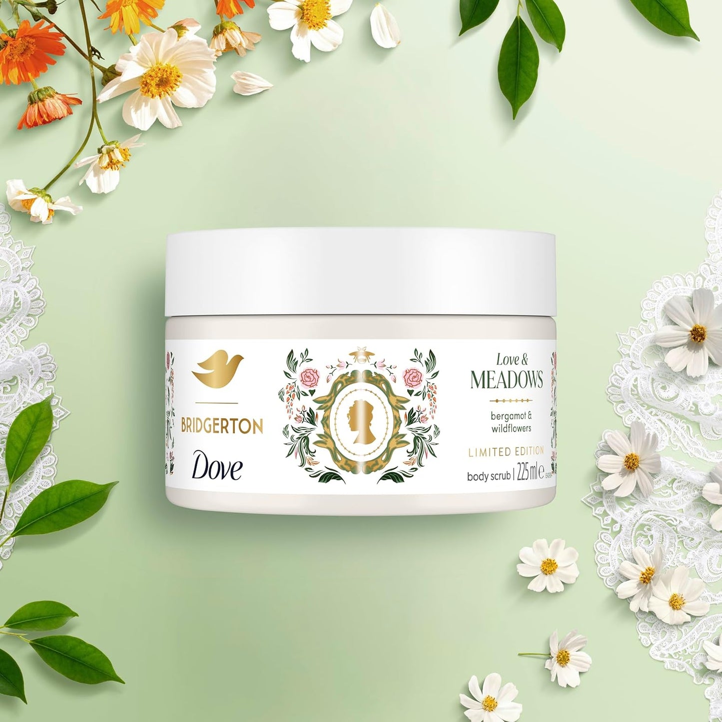 Jar of Bridgerton Dove body scrub on a light green background with flowers and leaves.